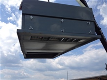 Multizone adapter curb being lifted into place